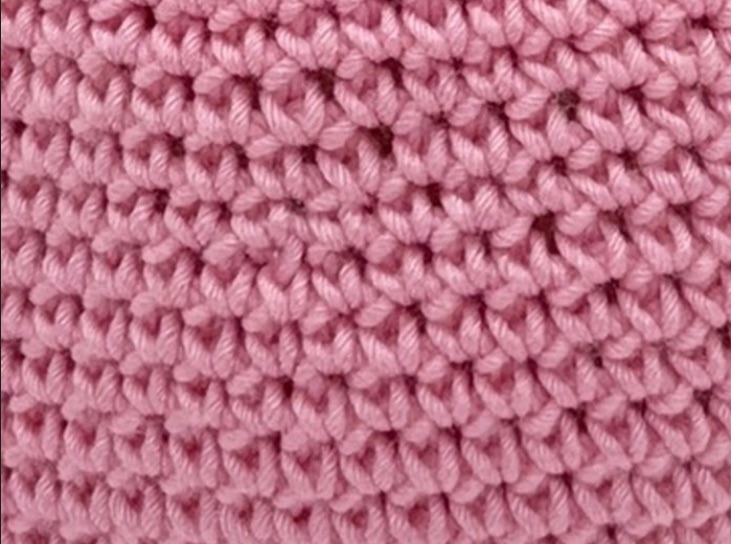 Close-up of pink crochet stitches